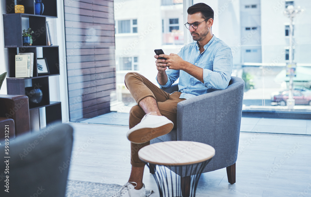 Poster Business networking can help you attain more growth. a young designer using a cellphone in an office.