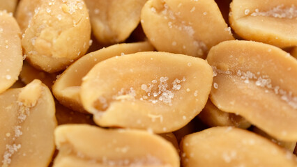 Salted roasted peanuts close up. Traditional snack to beer