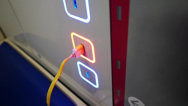 usb charging in the subway car. USB connector for charging a mobile phone
