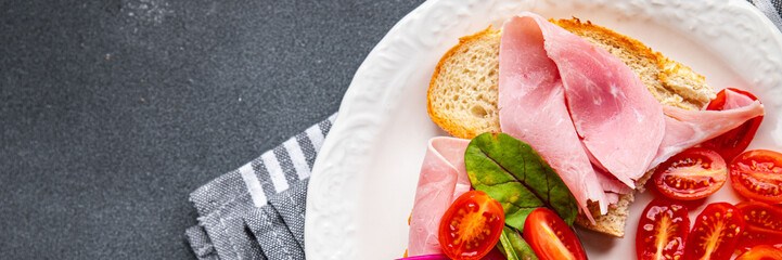 bruschetta ham sandwich tomato, lettuce snack meal food snack on the table copy space food background rustic top view