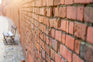 Old brick wall house texture with lights and shadows from sunlight. abstract close-up brick wall background