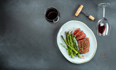 Barbecue steak with green asparagus and red wine. Healthy dinner or lunch. Long banner format. top view