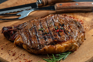 beef grill steak with fire. The concept of cooking meat, Food recipe background. Close up
