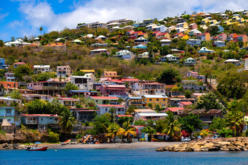Case Pilote is small ancient fishing vilalge and popular holiday destination in the Caribbean Sea on Martinique island (France). Small colorful houses on the idyllic coast with small bays and beaches.