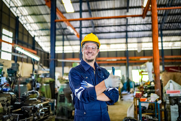 Lathe Operators Concentrated on Work. Worker in uniform and helmet works on lathe, factory. Industrial production, metalwork engineering, manufacturing.