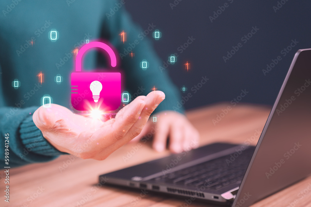 Aufkleber man showing open key icon with creativity light bulb symbol in hand while working on computer laptop