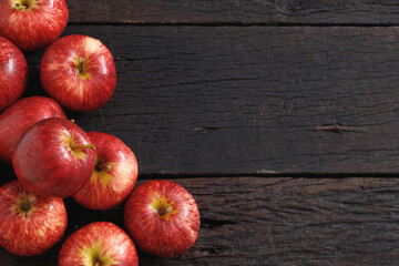 Fresh red apples on wood background
