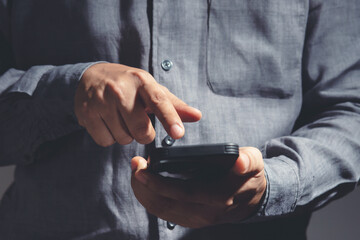 Young Man using mobile smart phone.