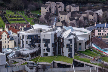 Modern building of Scottish Parliament in Edinburgh city, Scotland, UK, view from hills of Holyrood...