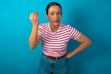 What the hell are you talking about. Shot of frustrated beautiful woman wearing striped T-shirt...