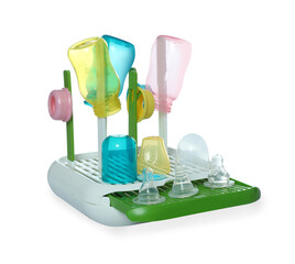 Dryer with baby bottles and nipples after sterilization on light grey table against white background
