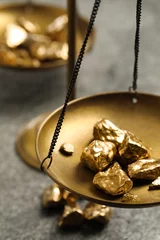 Zelfklevend Fotobehang Vintage scales with gold nuggets on grey table, closeup © New Africa