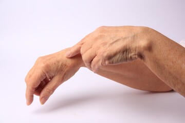 Closeup view of woman's hands with aging skin