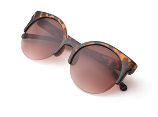 Folded spotted brown framed sunglasses