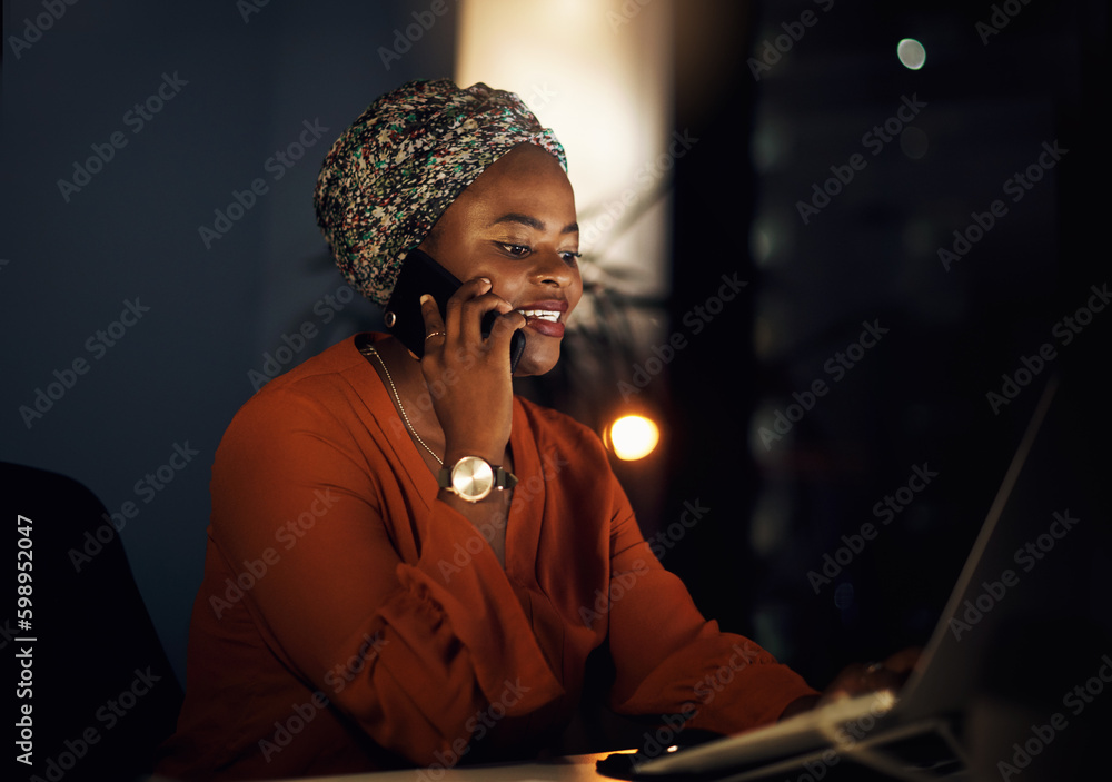 Aufkleber staying on top of tasks. a young businesswoman talking on a cellphone while using a laptop in an off