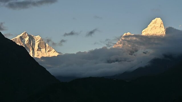 View of Mt.Ama Dablam and Mt.Lhotse view from Kyanjuma village (3,550 m) a small village in the Solukhumbu district of Nepal during sunset.