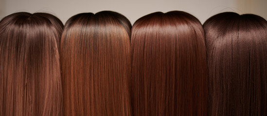 Showcase of natural looking wigs in different shades of brunette fixed on the wig holders in beauty...