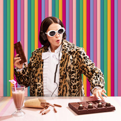 Chocolate dj station. Woman in stylish sunglasses and animal print coat playing music set with chocolate equipment over multicolored stripes background. Pop art, creativity, food, inspiration concept