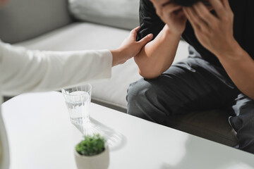 Professional psychologist conduct a consulting with sad patient in clinic..