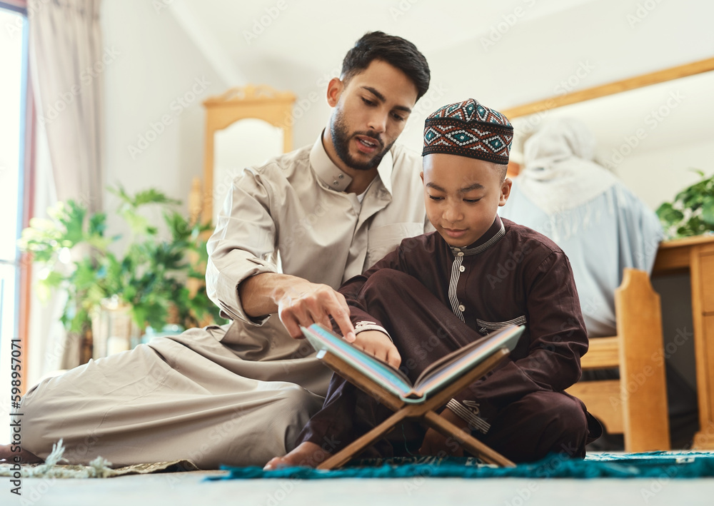 Canvas Prints Education is an admirable thing. a young muslim man and his son reading in the lounge at home.