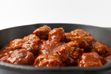Tomato meatballs on a white background