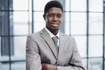 Happy african american young businessman in formal suit, portrait
