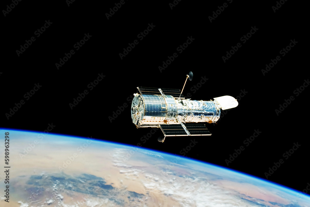 Wall mural a space telescope in outer space. elements of this image furnished nasa.