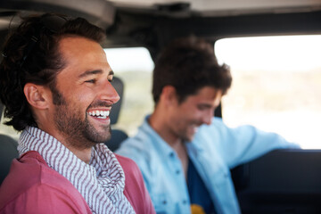 Good times with a great friend. Two friends happy and laughing together while on a drive.