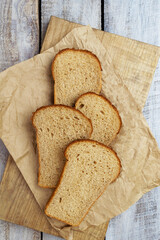 Freshly baked bread, crunchy bread, country bread. Crispy wheat and rye bread. Simple bread with butter for breackfast.