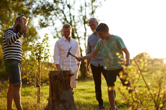 Family playing Stump outdoors