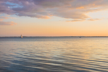 Sunset at Lake Balaton in Hungary, Calm water surface, pretty clouds, Concept, Holiday landscape
