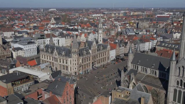 Panning left past St. Nicholas Church to reveal city of Ghent Belgium