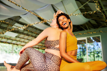 Women laughing after yoga class