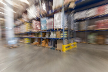 Zoom burst or zoom blur shot of a warehouse for food supplies, no people are visible. - 598973266