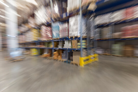 Zoom burst or zoom blur shot of a warehouse for food supplies, no people are visible.