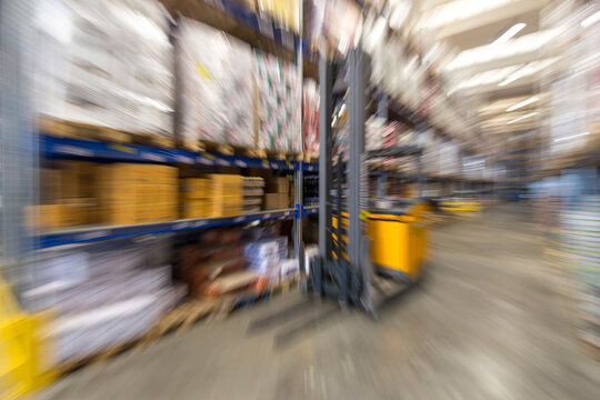 Zoom burst or zoom blur shot of a warehouse for food supplies, no people are visible.