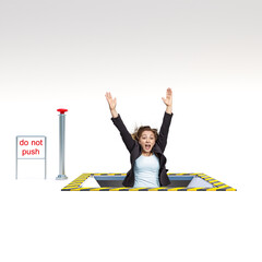 businesswoman falls into a trapdoor