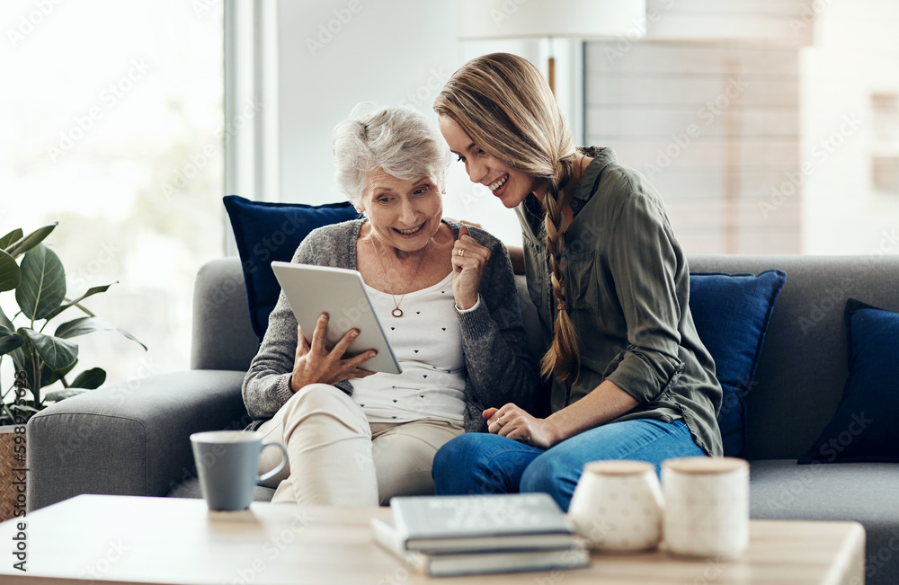 Poster Yay I got some likes. a senior woman and her daughter using a digital tablet together.