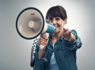 Join me on this great cause. Studio portrait of a senior woman using a megaphone against a grey background.