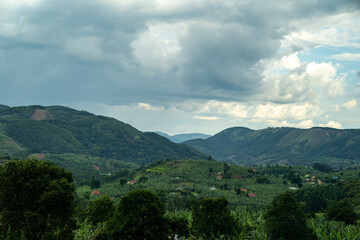 Fototapeta na wymiar Beautiful view of the Uganda countryside, with mountains and rolling hills and farmland