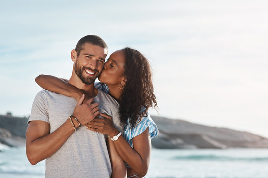 Youre All I Need In My Life. A Young Couple Enjoying Some Quality Time Together At The Beach.