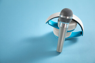 Headphones with a microphone on the blue background.