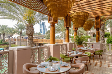 A restaurant with a view of the Burj al Arab in Dubai.