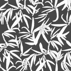 seamless pattern on a black background. bamboo stalks painted with grunge strokes.The leaves and branches are turquoise and white. For textiles, wallpaper, wrapping paper, fashion prints, tile, fabric