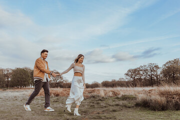 happy couple in the park on a beautiful sunny day