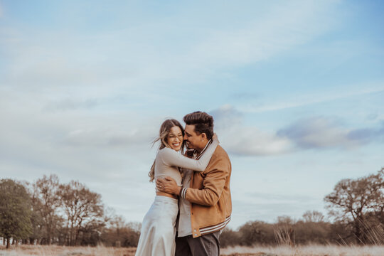 happy couple in the park on a beautiful sunny day