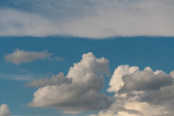 Obraz premium Beautiful fluffy clouds on the blue sky. Sky clouds background.