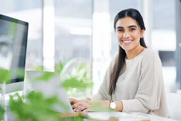 You accomplish a lot more with a positive mindset. Portrait of a young businesswoman working on a...
