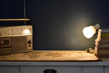 vintage radio and cassette player on a table with map