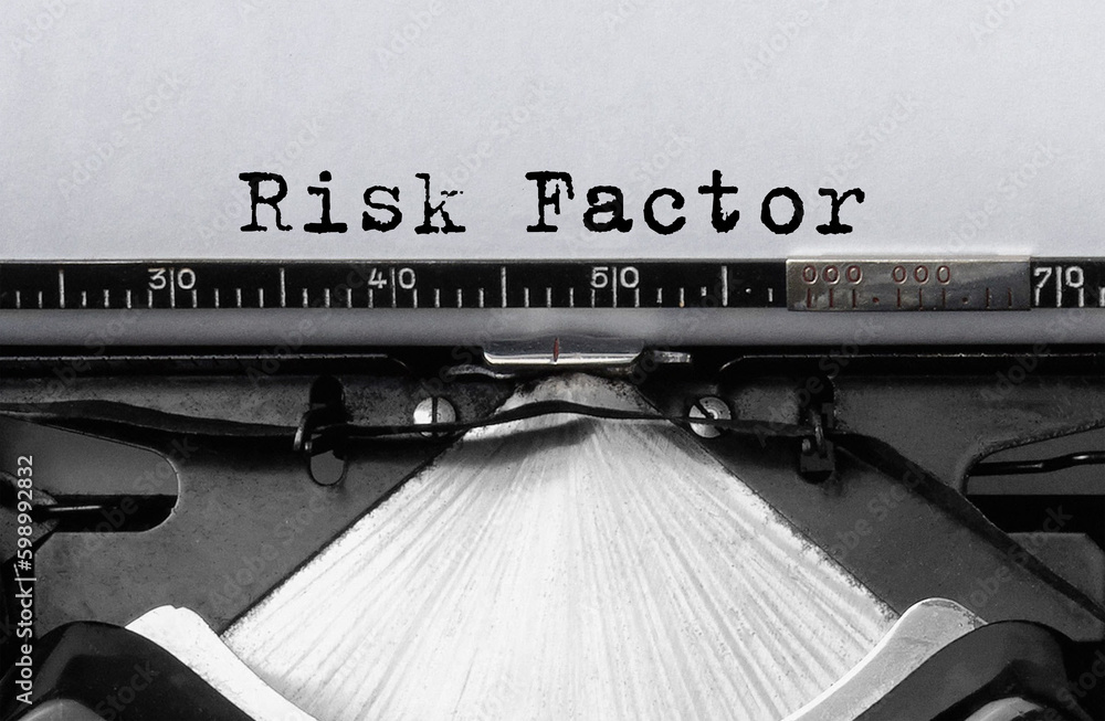 Poster text risk factor typed on retro typewriter